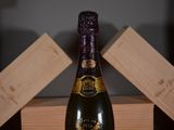 a bottle of wine that is sitting on a table
