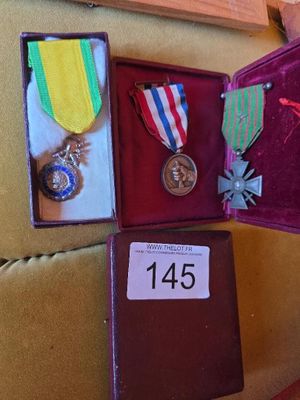 several medals and medals are in a case on a couch