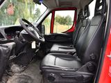 a red truck with black seats and a steering wheel