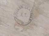 a close up of a piece of wood with a stamp on it