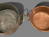 two pans that are sitting next to each other