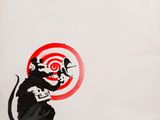 painting of a rat with a target in its mouth and a dart in its mouth
