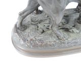a statue of a horse that is running on the ground