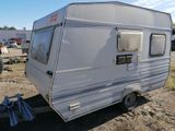 an image of a trailer parked in the dirt