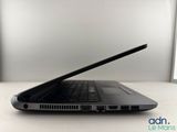 a laptop that is sitting on a table with its lid open