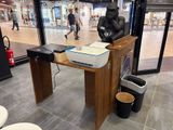 a statue of a gorilla sitting on a desk in a store