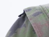 close up of a camouflage shirt with a zipper on the back