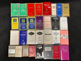 many different types of cigarettes on a black surface