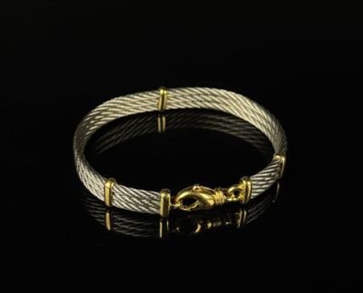 FRED, dans le goût de. Bracelet en acier tressé et en or jau…