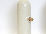 two vases that are sitting on a white surface