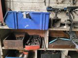 many tools and tools on a shelf in a garage