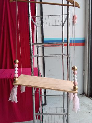 an image of a wooden and metal bird cage