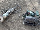 two tools that are laying on the ground next to each other