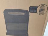 a box that has a black air purifier inside of it