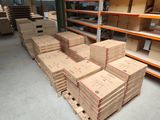 a large amount of boxes stacked on a pallet in a warehouse