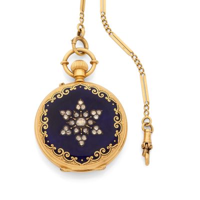 a close up of a pocket watch with a chain on a white background