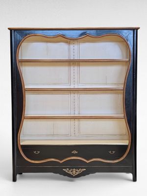 an image of a black and gold bookcase with shelves