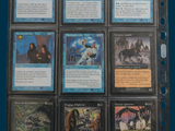 a lot of cards that are in a binder