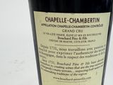 a close up of a bottle of wine on a table