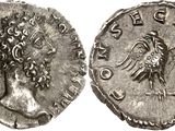 a silver coin with an image of a woman on it