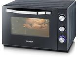 an image of a black toaster oven with a roasting chicken in it