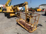 a crane that is sitting in the middle of a parking lot
