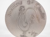 une pièce d'argent sur laquelle figure un coq