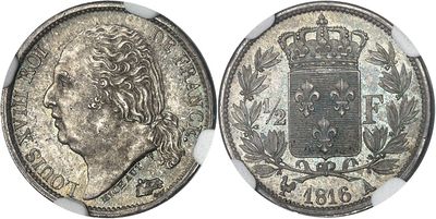 a silver coin with a crown on top of it