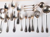 a lot of silver spoons and spoon spoons on a table