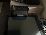 a tablet computer sitting on top of a table next to a laptop computer