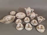 many pieces of china on display on the table