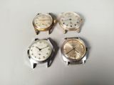 three different types of watches are sitting next to each other