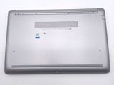 a laptop that is sitting on a white surface