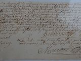 a piece of paper with writing on it sitting on top of a table
