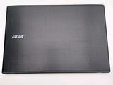 a black laptop sitting on a white surface