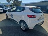 a white car that is parked in a parking lot
