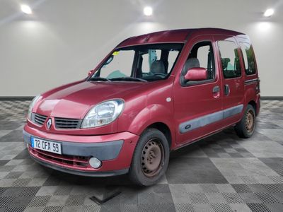 a picture of a small red van parked in a garage