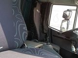 a picture of the inside of a truck with the driver ' s seat up