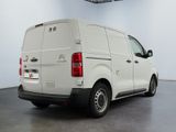 a picture of a white van parked in a room