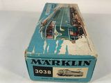 a box with a train on it sitting on a white surface