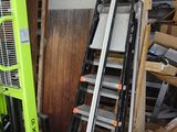 two ladders that are next to each other in a garage