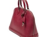 a red louis vuitton bag on a white background