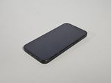 an iphone is sitting on a table with a white background