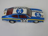 a toy car that is sitting on a white surface