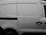 a white van that is parked in a parking lot