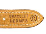 an image of a brown leather watch strap with the words braclet hermess on it