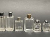 a lot of bottles that are lined up on a table