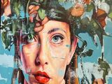 a painting of a woman with flowers on her head