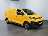 the yellow van is parked in a large room