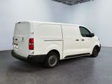 the white van is parked in the empty room of the building